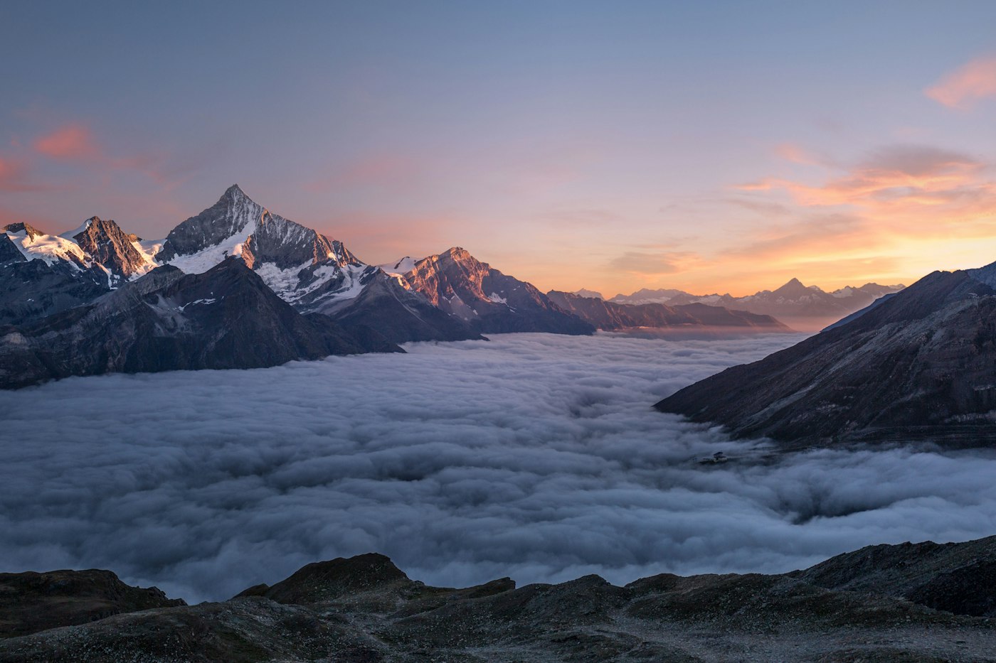 Alpine ridgeline under soft morning haze