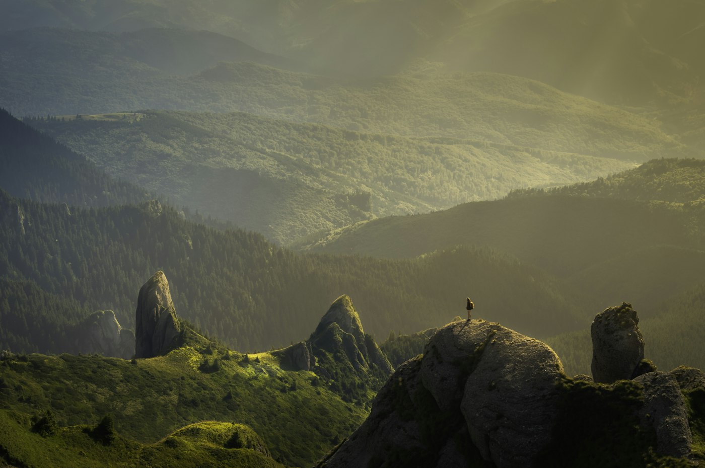 Sun breaking over a mountain valley
